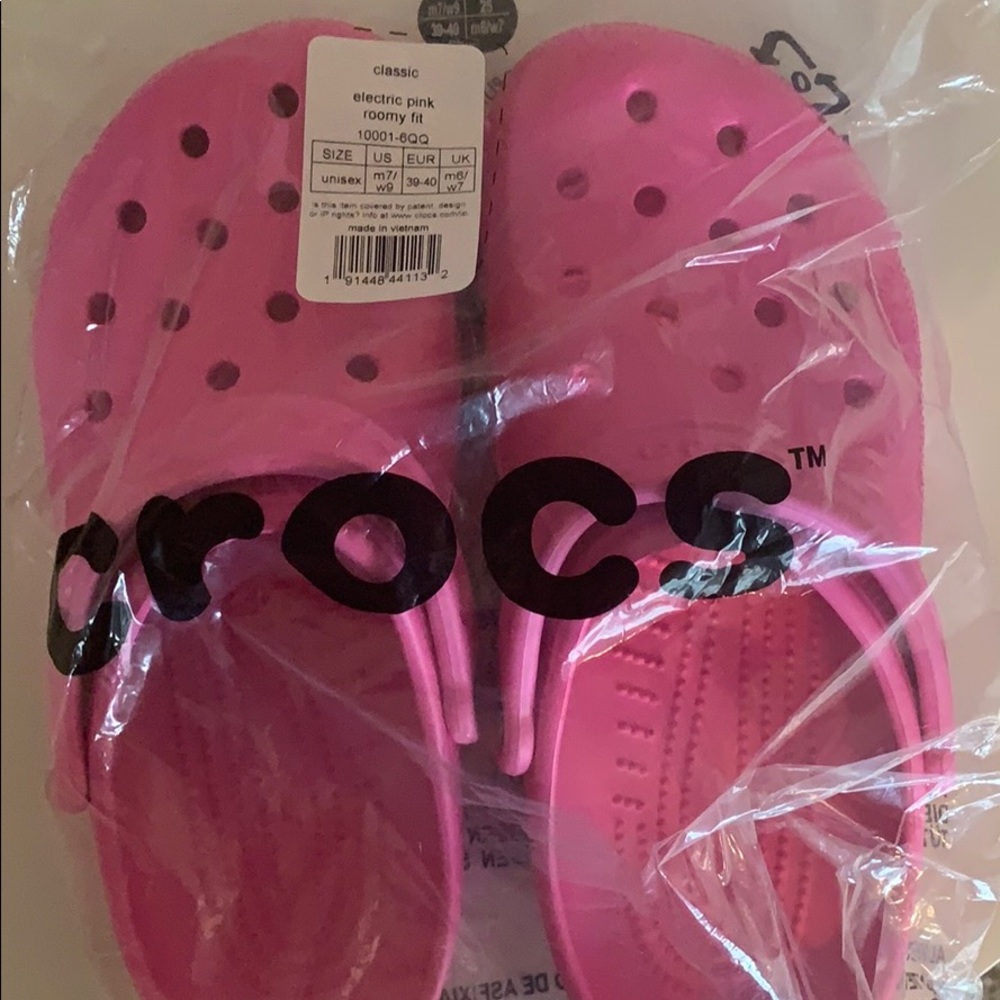 Electric pink crocs